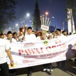 Bupati Bogor, Rudy Susmanto saat mengikuti pawai obor