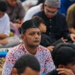 Salah satu jamaah yang sedang melaksanakan sholat idul fitri di Kebon Raya Bogor, Foto/Diskominfo Kota Bogor