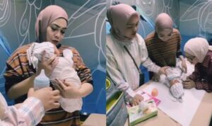 Mama Rieta saar menggendong bayi laki-laki diduga hasil adopsi Raffi-Nagita, Tangkapan layar youtube @ransEntertaint