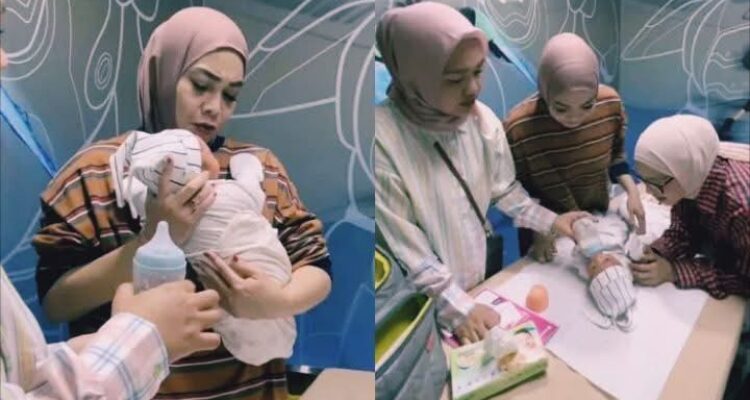 Mama Rieta saar menggendong bayi laki-laki diduga hasil adopsi Raffi-Nagita, Tangkapan layar youtube @ransEntertaint